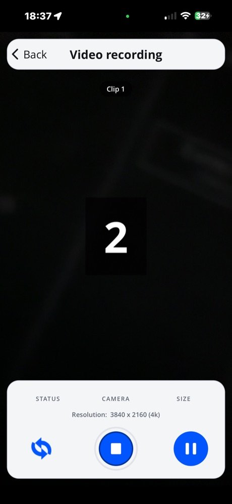Video recording screen with live camera preview labelled Clip 1